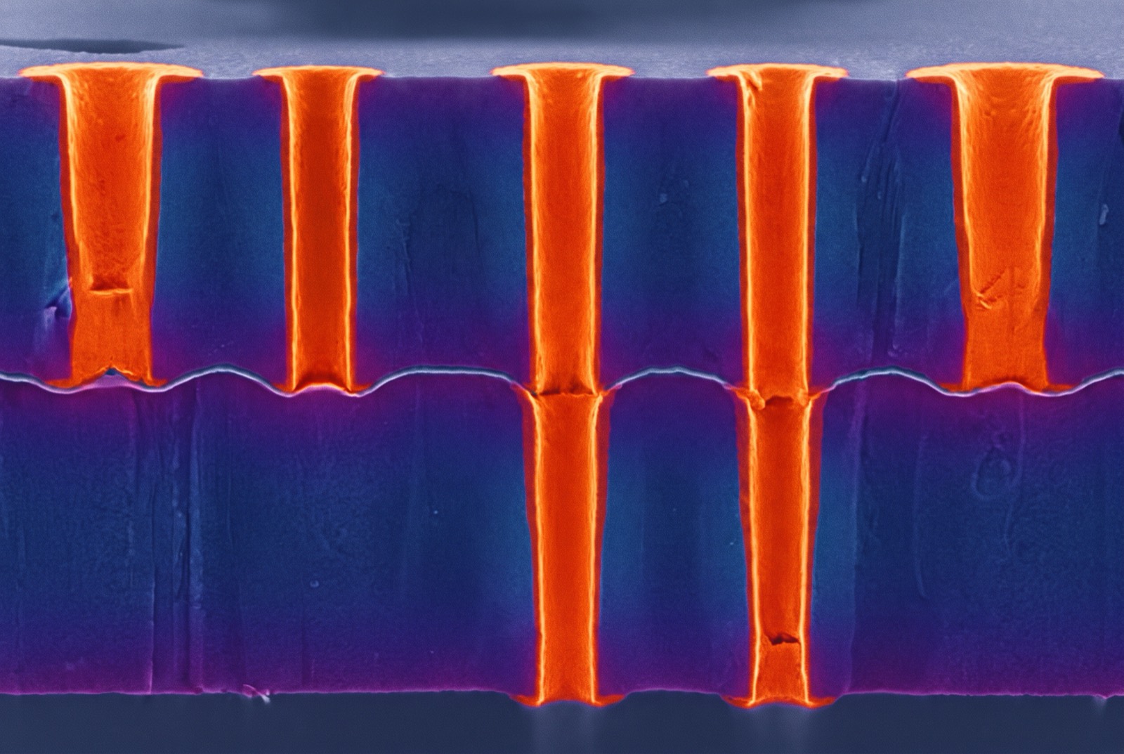 Copper-filled through-silicon vias in a bonded wafer stack